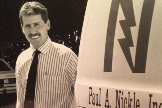 Steve posing by company truck in 1990